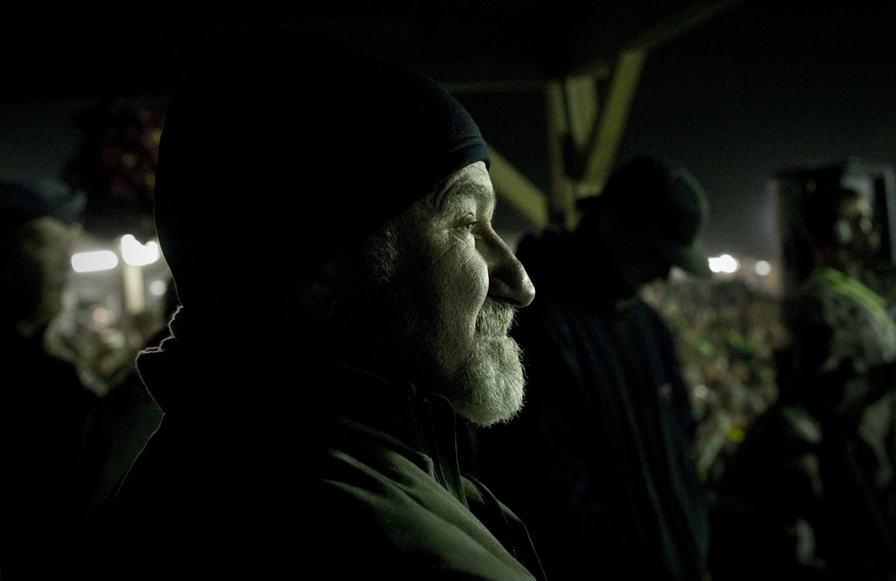 Actor Robin Williams watches from the backstage area during during a